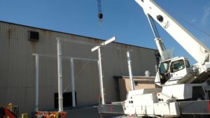 Erecting steel for acid storage building at Steel Warehouse in South Bend, IN