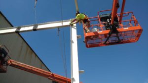 Erecting steel for acid storage building at Steel Warehouse in South Bend, IN