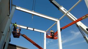 Erecting steel for acid storage building at Steel Warehouse in South Bend, IN