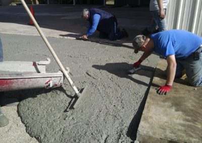 MCB crew pouring and finishing concrete