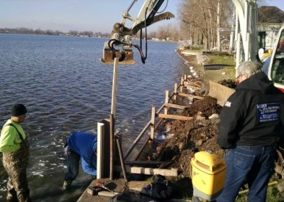 Driving sheet piles for a seawall project at Lake of The Woods in Bremen, IN